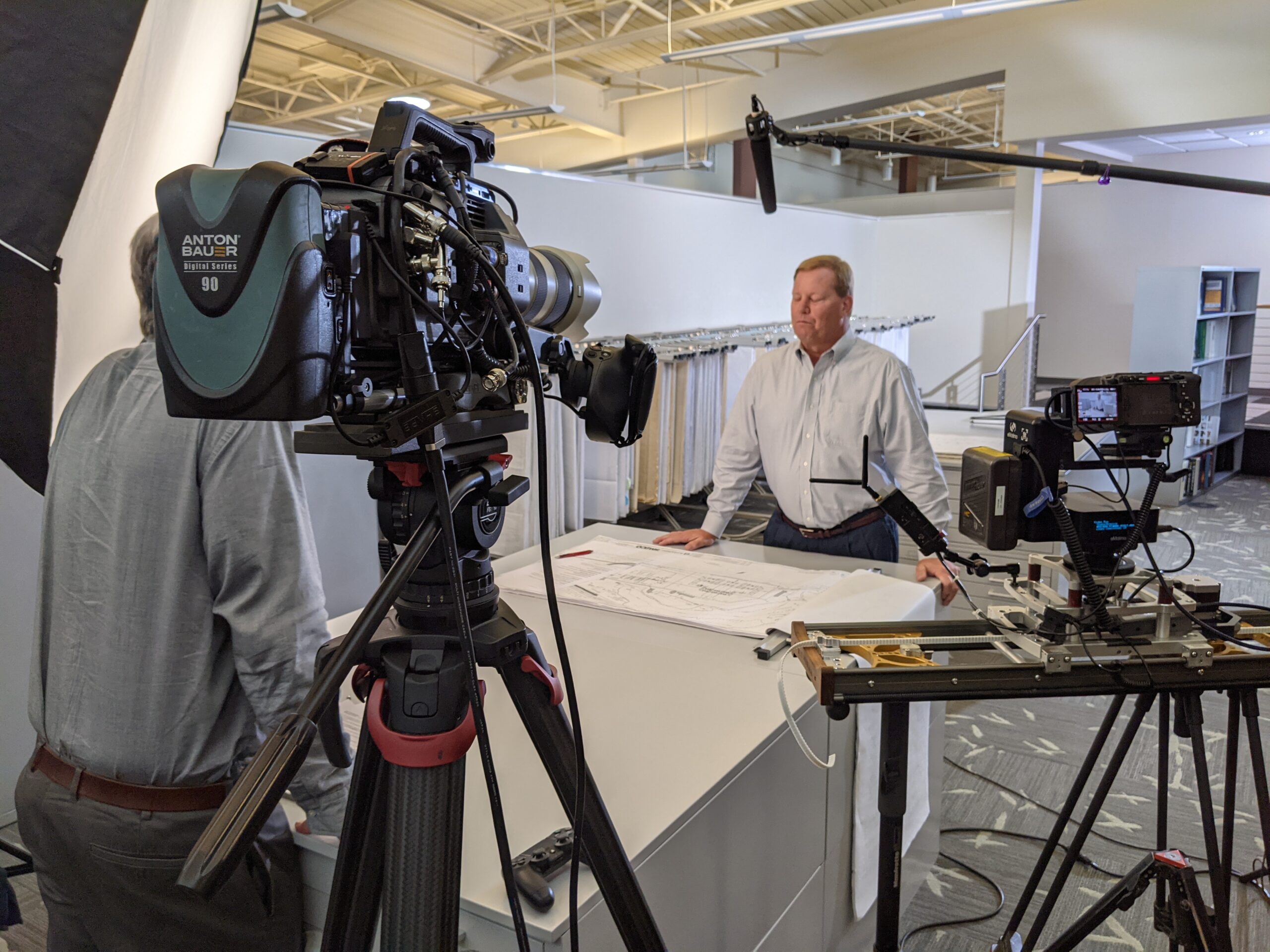 Interviewing a corporate engineer using Sony FX9 with a Sony 70-200 GM lens and an FX3 on a motorized slider